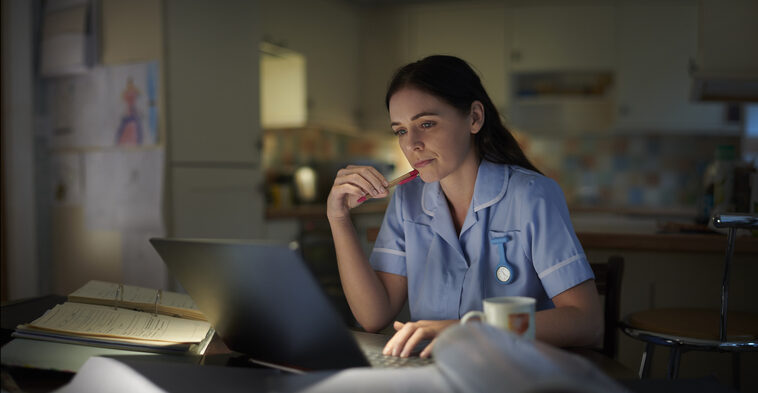 Medical student burning the midnight oil after a long shift