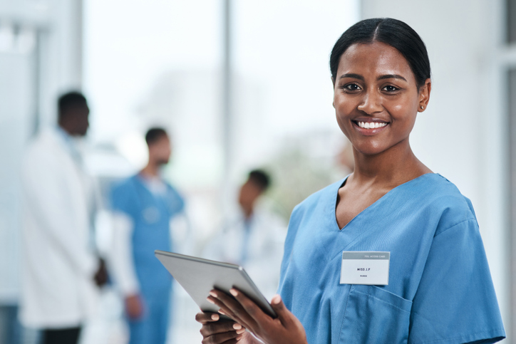 Portrait of a young nurse using a digital tablet in a hospital