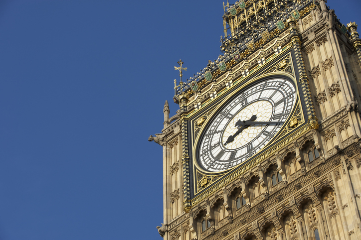 Clock face of Big Ben in London showing the time as eight twenty two in the morning on a clear blue sky day