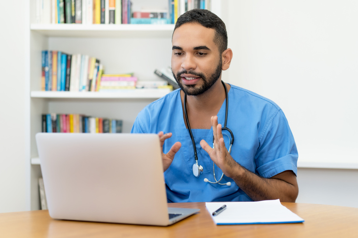 Video call of a latin american male nurse at computer at hospital