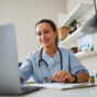 Female Doctor working on a computer at her desk