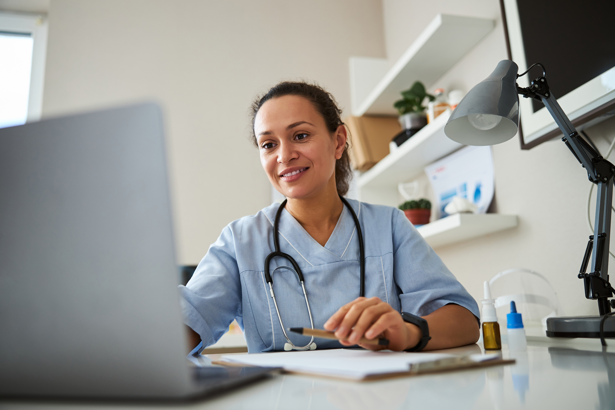 Female Doctor working on a computer at her desk