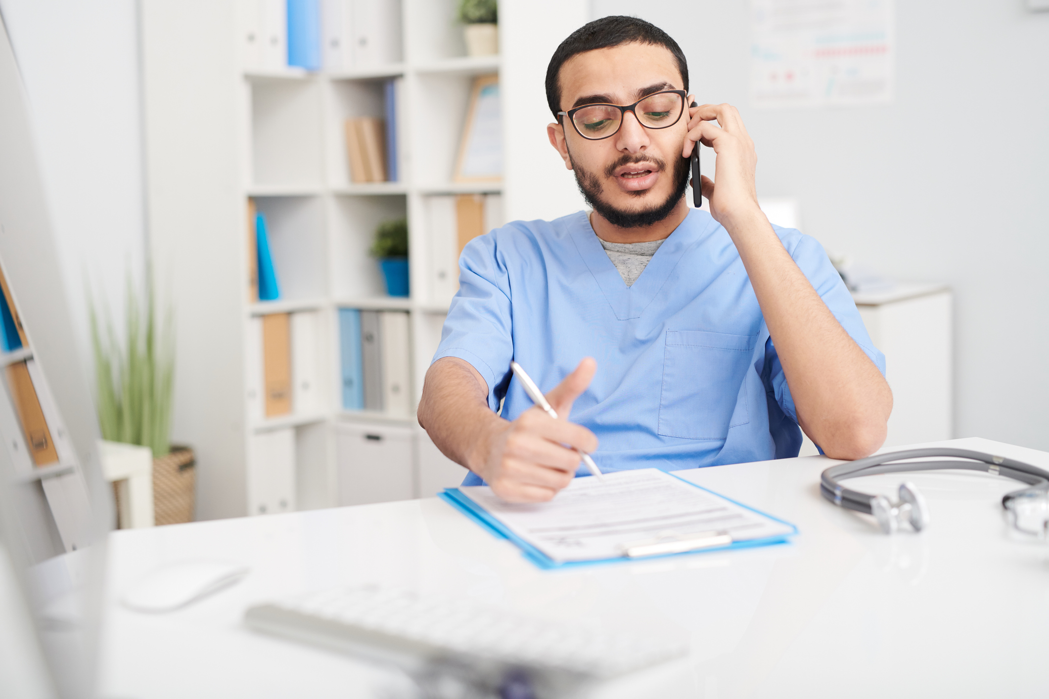 Middle Eastern Doctor speaking on mobile phone