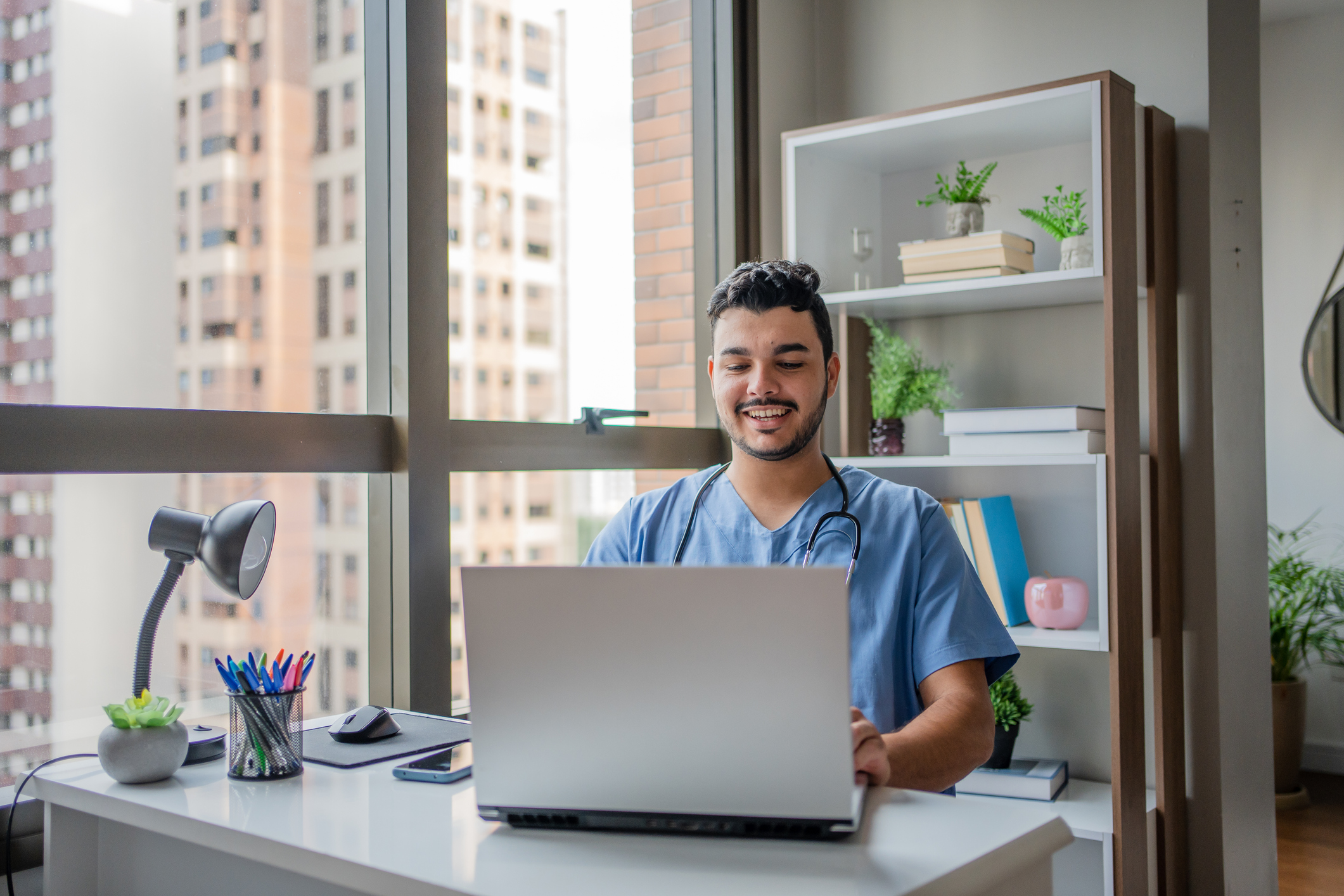 Male nurse on telemedicine in his office