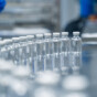 Bottles on a conveyor belt at a pharmaceutical bottle manufacturing plant