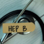 Hep B write on sticky notes isolated on Wooden Table. healthcare Concept